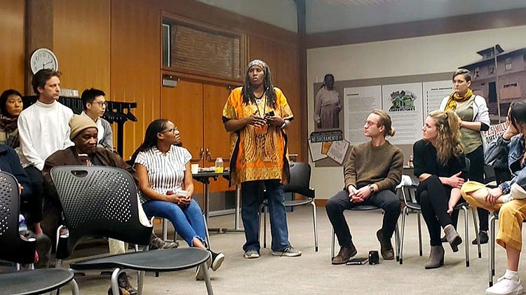 person talking to group